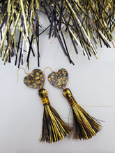 Load image into Gallery viewer, Black n Gold Heart Glitter Metallic Tinsel Tassel Earrings Game Day Earrings
